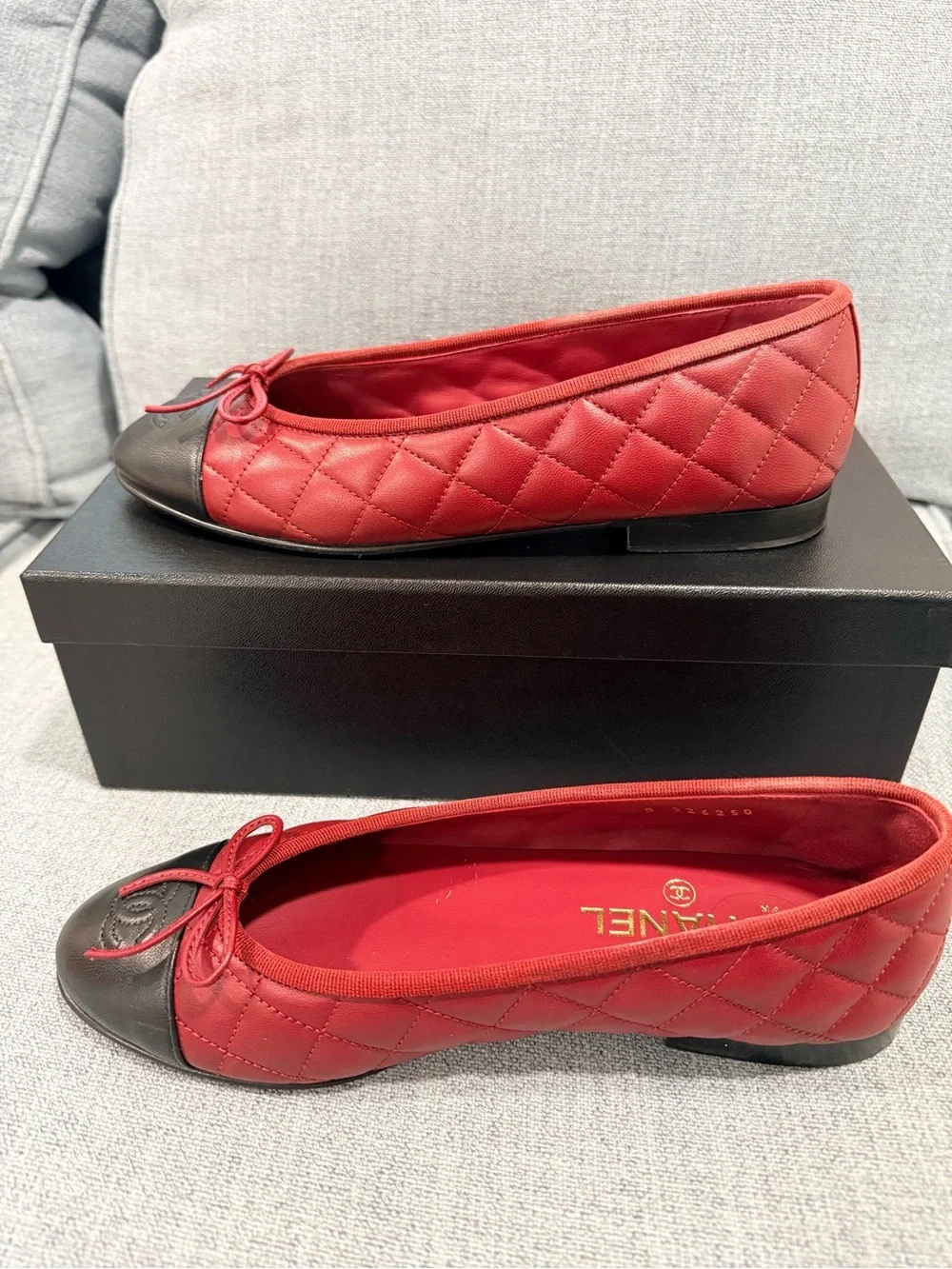 CHANEL Red Leather Ballet Flats with Black Cap Toe